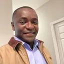 Rajil in a tan jacket